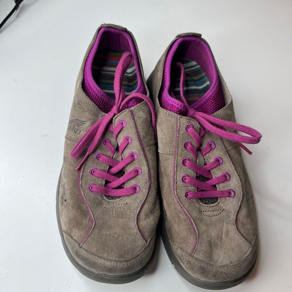 Dansko Elise tan suede comfort sneakers, featuring vibrant pink laces and purple